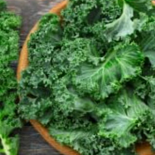 Green leafy kale on a wooden surface